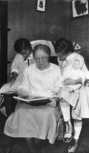 Grandma Smith reading to girls