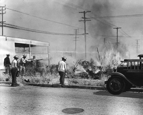 Fire Department members clear vacant lots