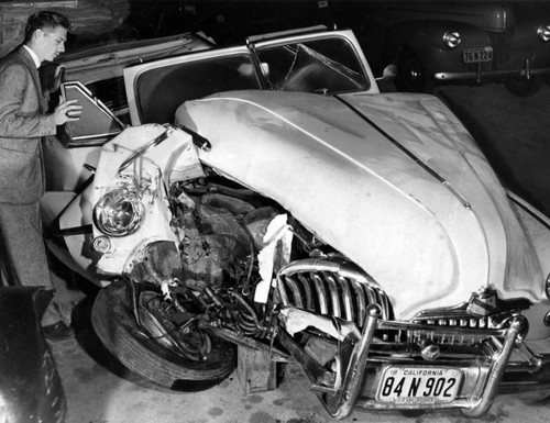 Louis Hayward's auto demolished in light pole crash