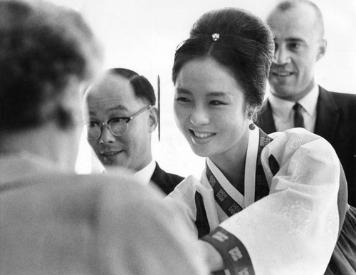 Miss Korea greets guests with a smile