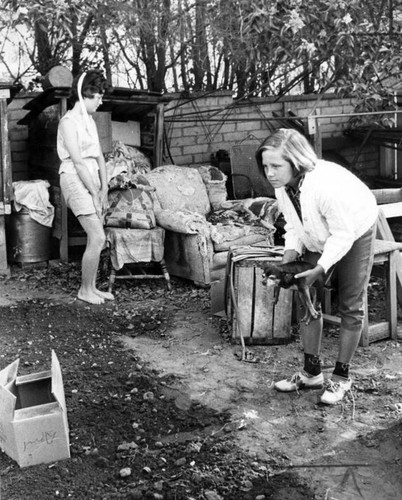 Rhonda and Leslie, left to right, inspect suspect's chair