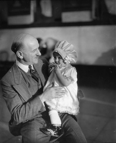 Man holds girl modeling clothing