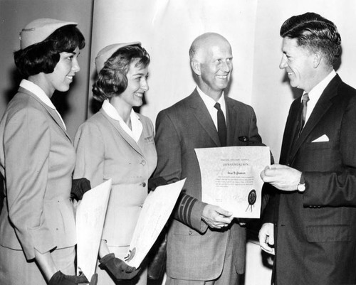 FAA official Najeeb Halaby, right, presents commendation