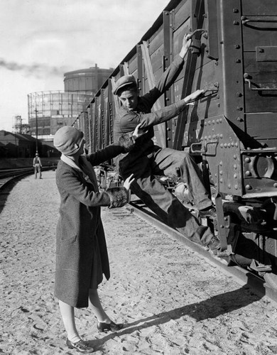 Walter Burke arrives in a freight "gondola"