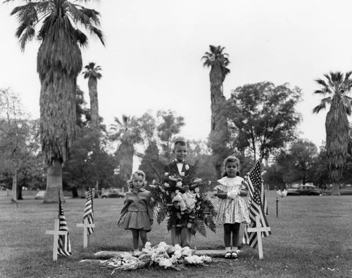 Children holding flags and flowers