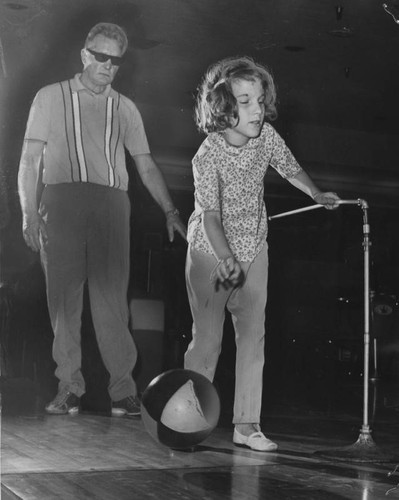 Blind girl learns how to bowl