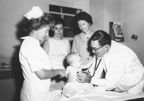 Baby getting exam at St. Joseph Hospital's Children's Clinic