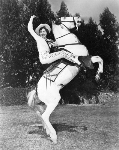 Mrs. Schweiger as rodeo trick rider