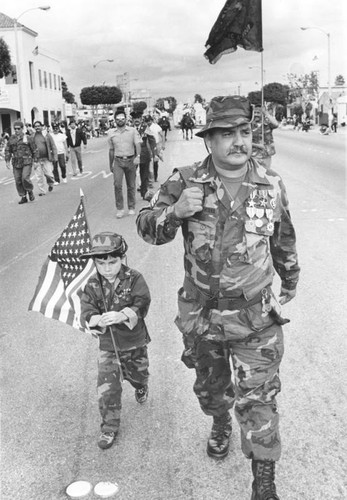 Veteran and youngster in veterans parade