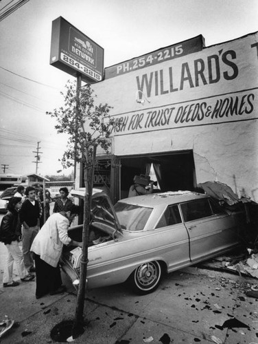 Car drives through storefront