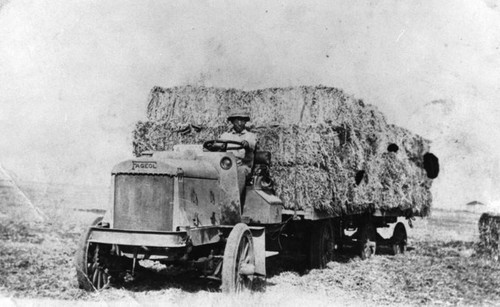 Man driving hay truck