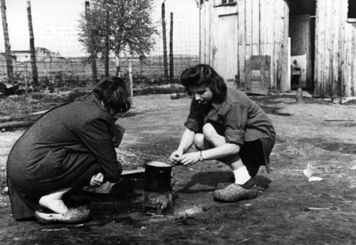 Polish woman prepare food in German POW camp
