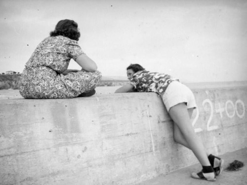 Leaning against a wall, Corona del Mar