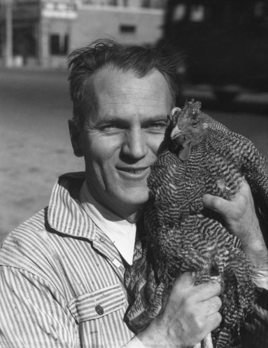 Man holding chicken