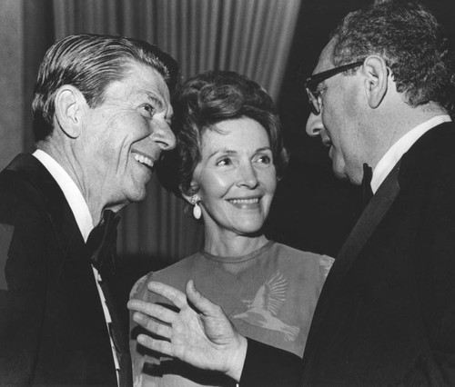 Ronald Reagan, wife Nancy, and Henry Kissinger