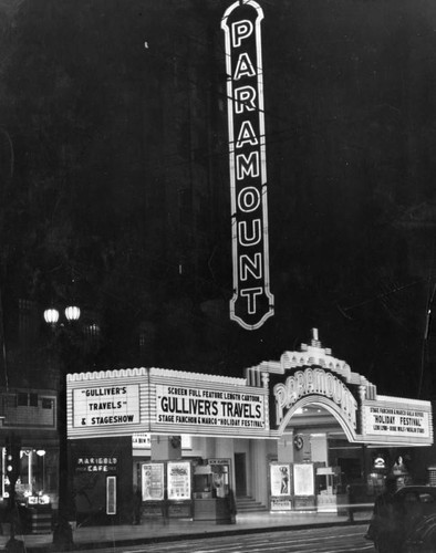 Vertical electric sign and marquee at night