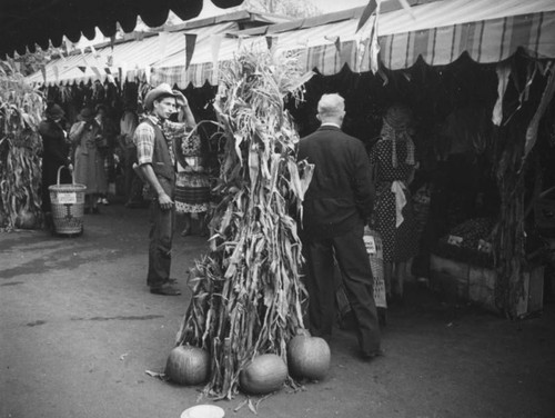 Farmer tips his hat at the Farmers Market Fall Festival