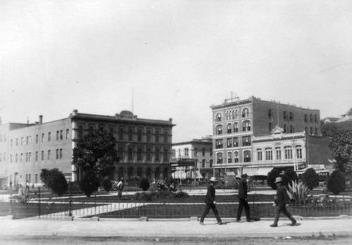 Men strolling in front of the L.A. Plaza