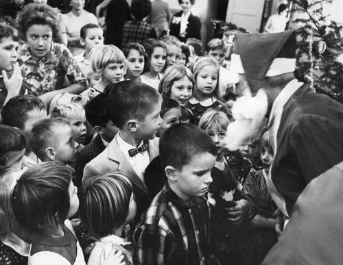 Santa greets children