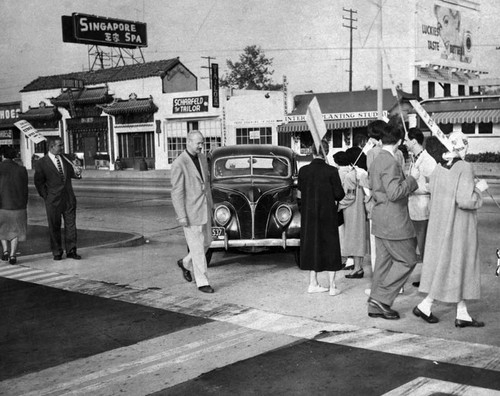 Car breaks picket line