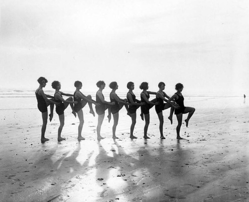 Women dancing on beach, Long Beach