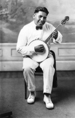 American Indian student with banjo