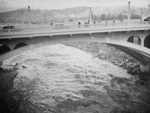 L.A. River flooding, turbulent water under the Dayton Avenue Bridge