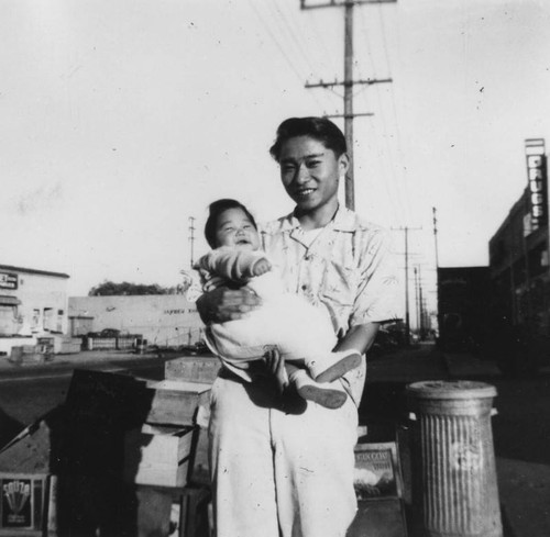 Japanese American boy with baby