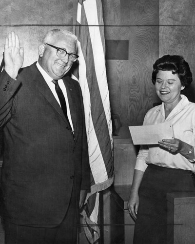 New councilman takes oath from city clerk Leila Edwards