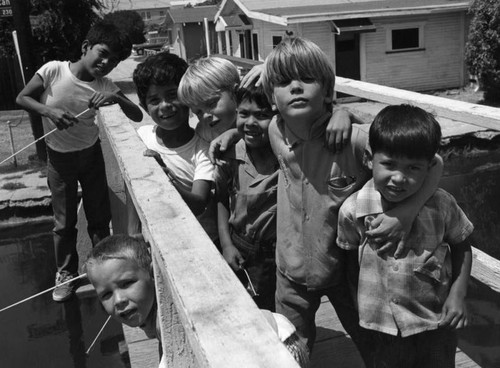 Children fishing at the footbridge