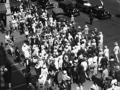 Shoppers crowd Broadway at 6th Street