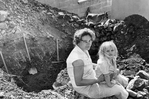 Mrs. Eldridge, Sunland, digs her own bomb shelter