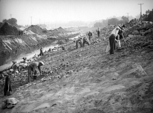 Removing rocks from the banks of Los Angeles River