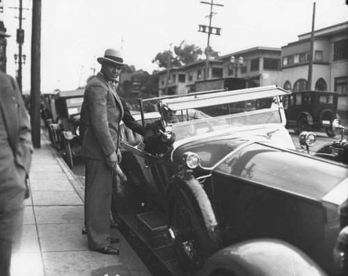 Jack Dempsey in front of restaurant