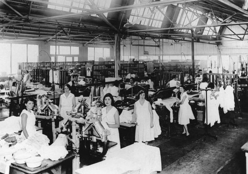 Laundry workers in shop