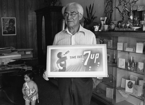 Louis Sauceda with 7up sign