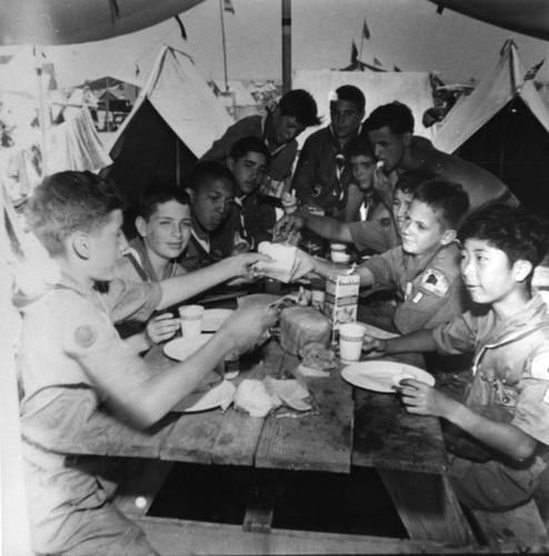 Boy Scouts eating in tent