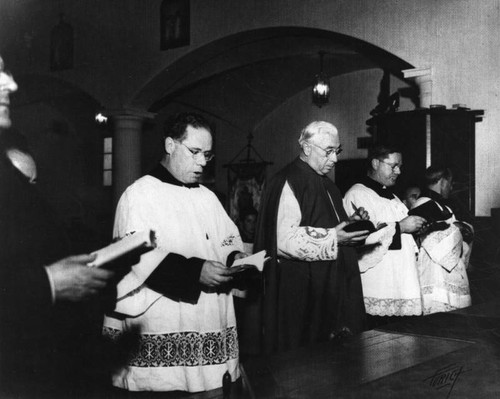 Bishop and priests at Holy Family Catholic Church