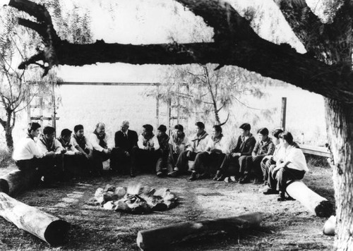 American Indian Boy Scouts around campfire