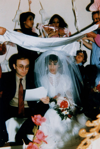 Bride and groom under wedding canopy