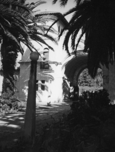 View of the plaza through an arched entry at Zoopark