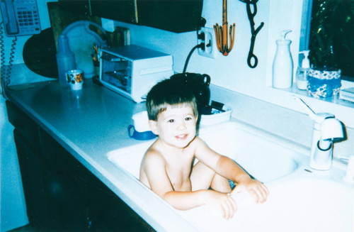 Boy taking a bath