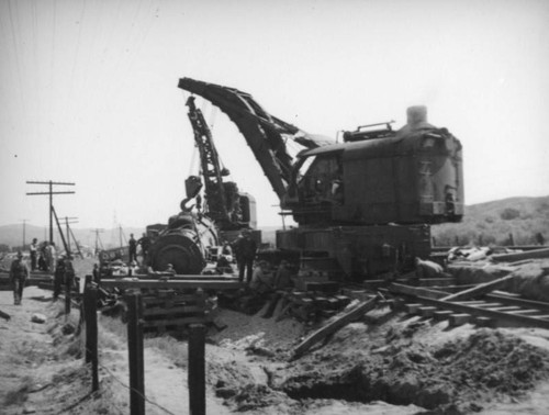 Two cranes and a derailed train car, Mint Canyon