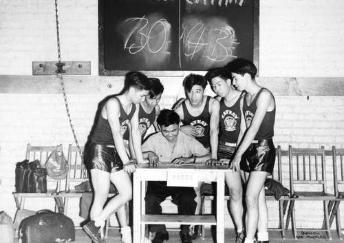 Boys playing basketball