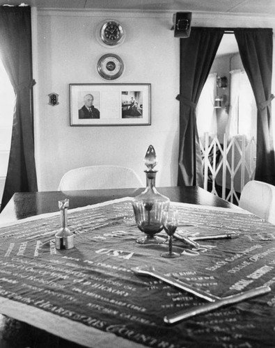 Wardroom's mahogany table covered with favorite cloth