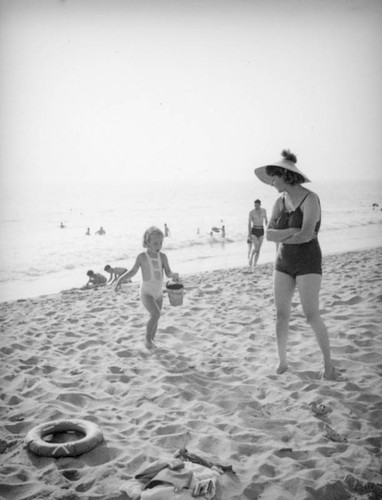 Girl and mother at the beach