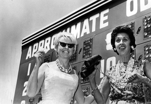 Cheering him home is half the fun for Carol and Sue