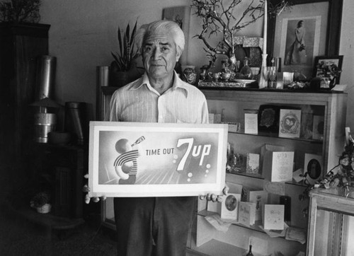 Louis Sauceda with 7up sign