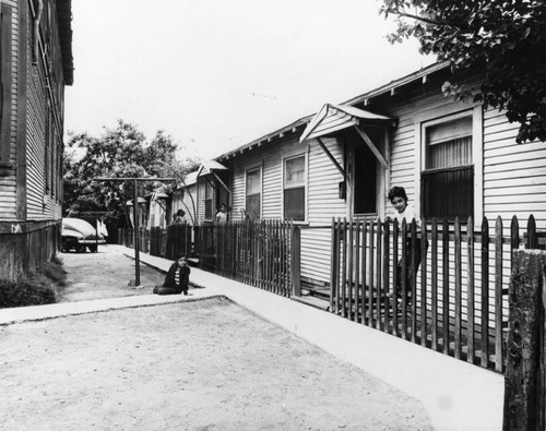 Children posed outside their run down homes