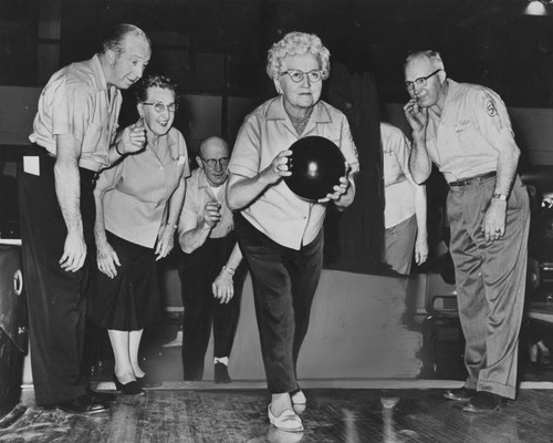 Edlerly woman bowling